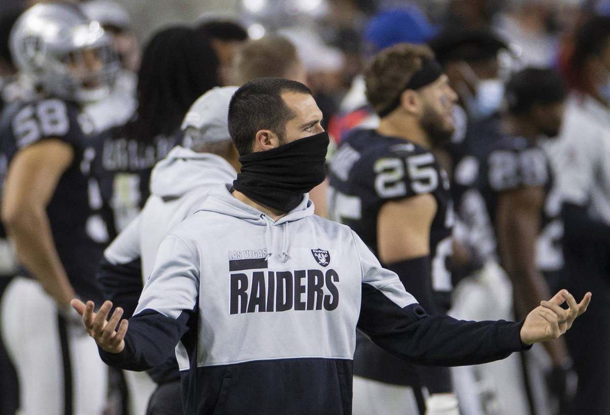 Raiders quarterback Derek Carr puts his hands up in frustration in the fourth quarter during an ...