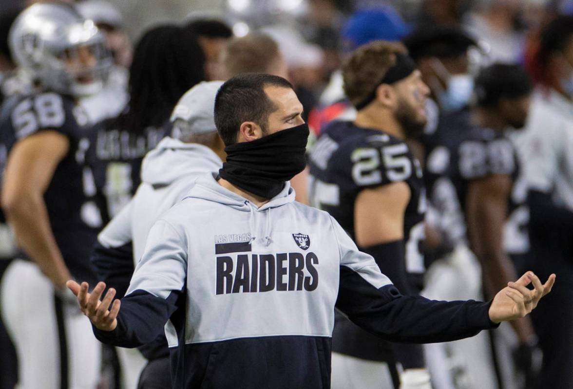 Raiders quarterback Derek Carr puts his hands up in frustration in the fourth quarter during an ...