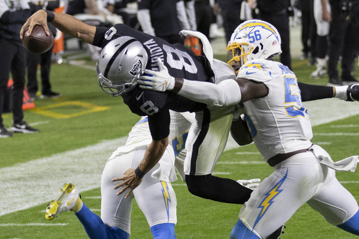 Raiders wide receiver Siaosi Mariner (9) leaps over Los Angeles Chargers outside linebacker Ken ...