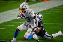 Los Angeles Chargers wide receiver Tyron Johnson (83) scores a touchdown as Raiders cornerback ...