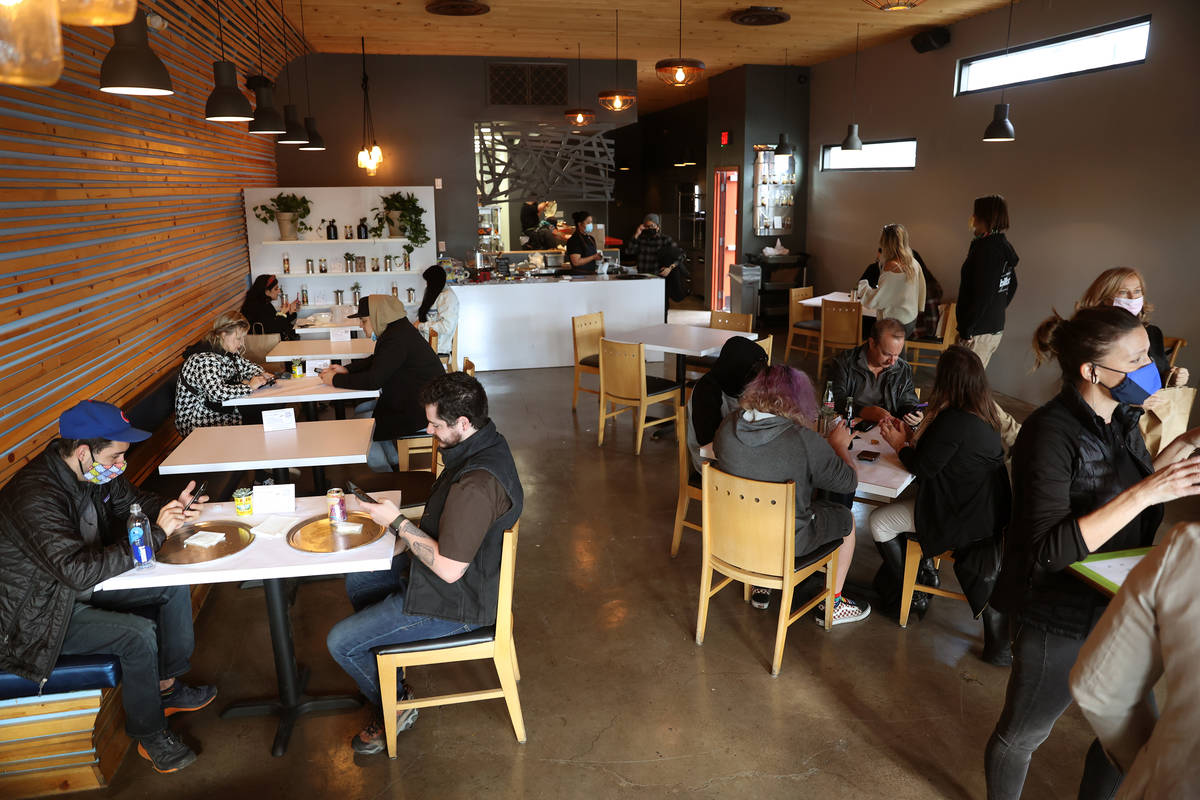 People dine at Vegas Test Kitchen in Las Vegas on Saturday, Dec. 12, 2020. (Erik Verduzco / Las ...