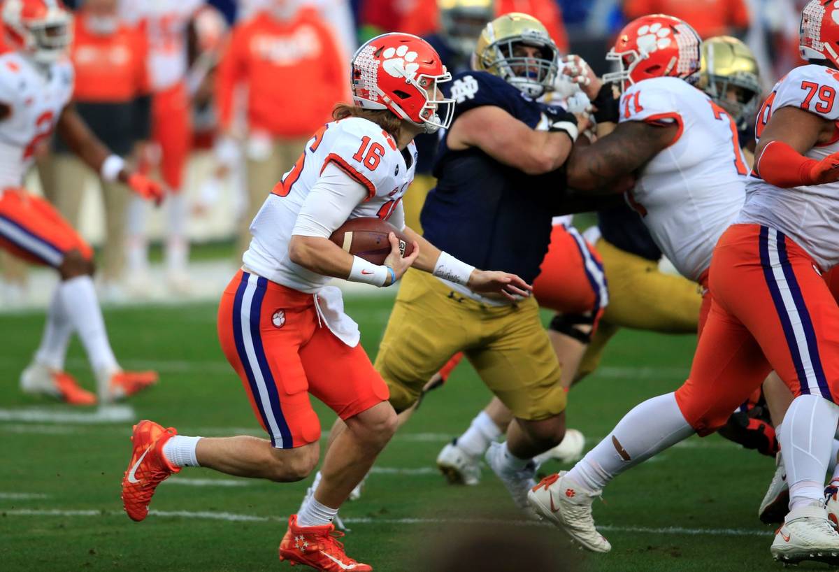 Clemson quarterback Trevor Lawrence (16) runs the ball during the first half of the Atlantic Co ...