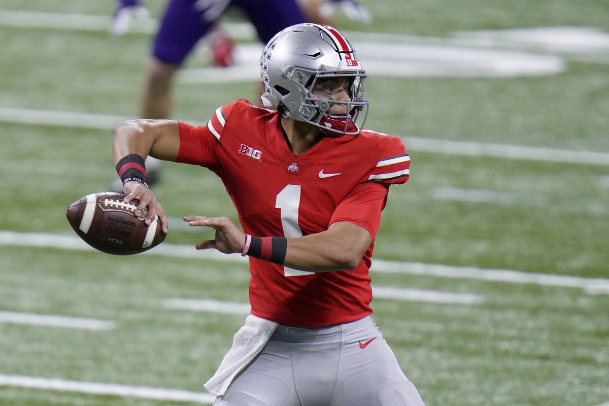 Ohio State quarterback Justin Fields throws during the first half of the Big Ten championship N ...