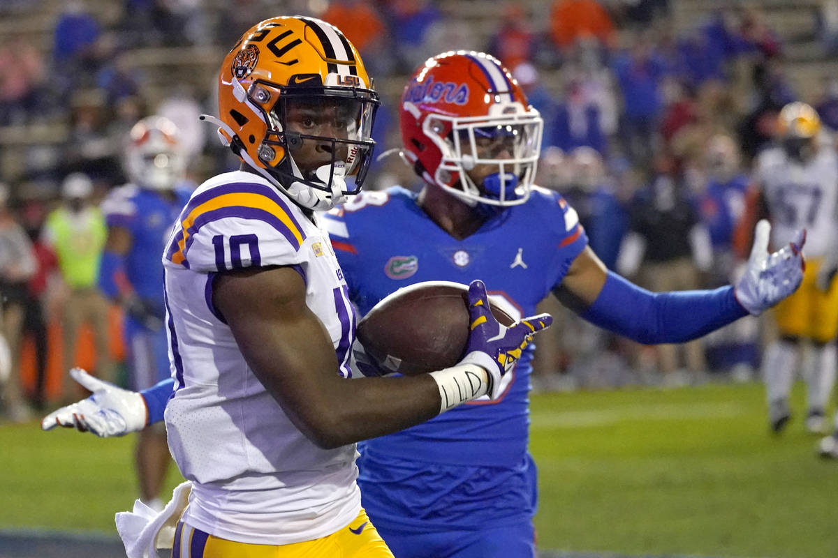 LSU wide receiver Jaray Jenkins, left, catches a 5-yard pass for a touchdown in front of Florid ...