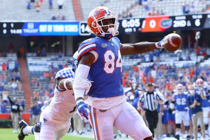 FILE - Florida Gators tight end Kyle Pitts (84) scores a touchdown during an NCAA college footb ...