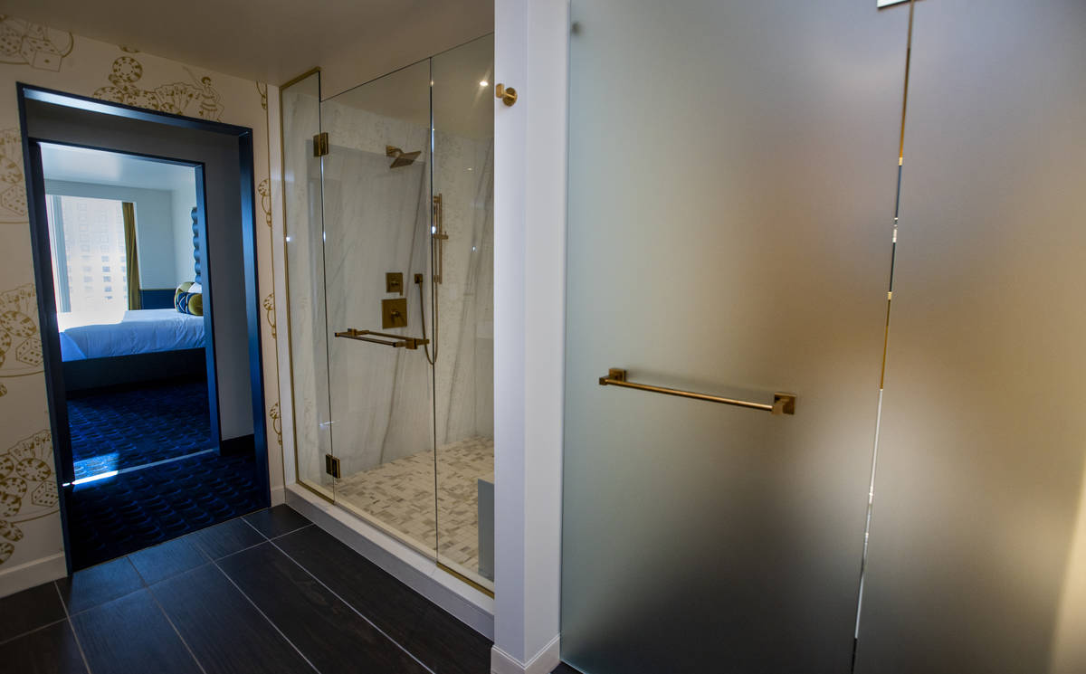 A frosted-glass toilet area and walk-in shower as part of the bathroom amenities within the Cir ...