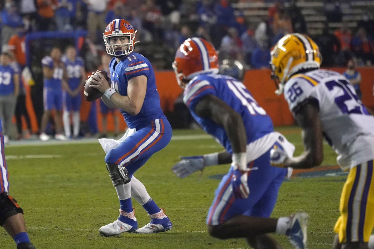 Florida quarterback Kyle Trask (11) looks for a receiver against LSU during the first half of a ...
