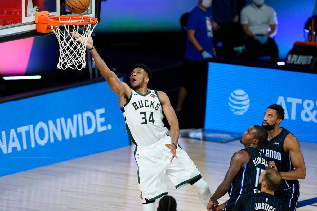 Milwaukee Bucks' Giannis Antetokounmpo (34) drives to the basket during the first half of an NB ...