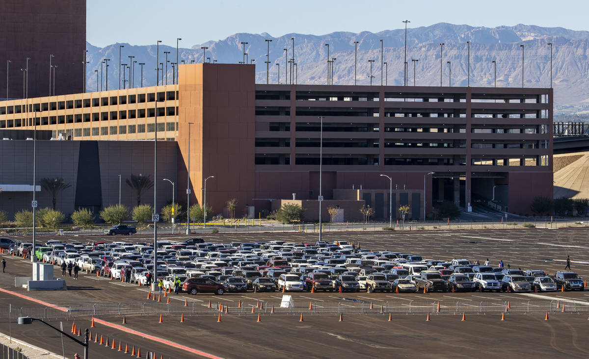 Hundreds of cars are assembled in the World Market parking lot as the Las Vegas Rescue Mission ...