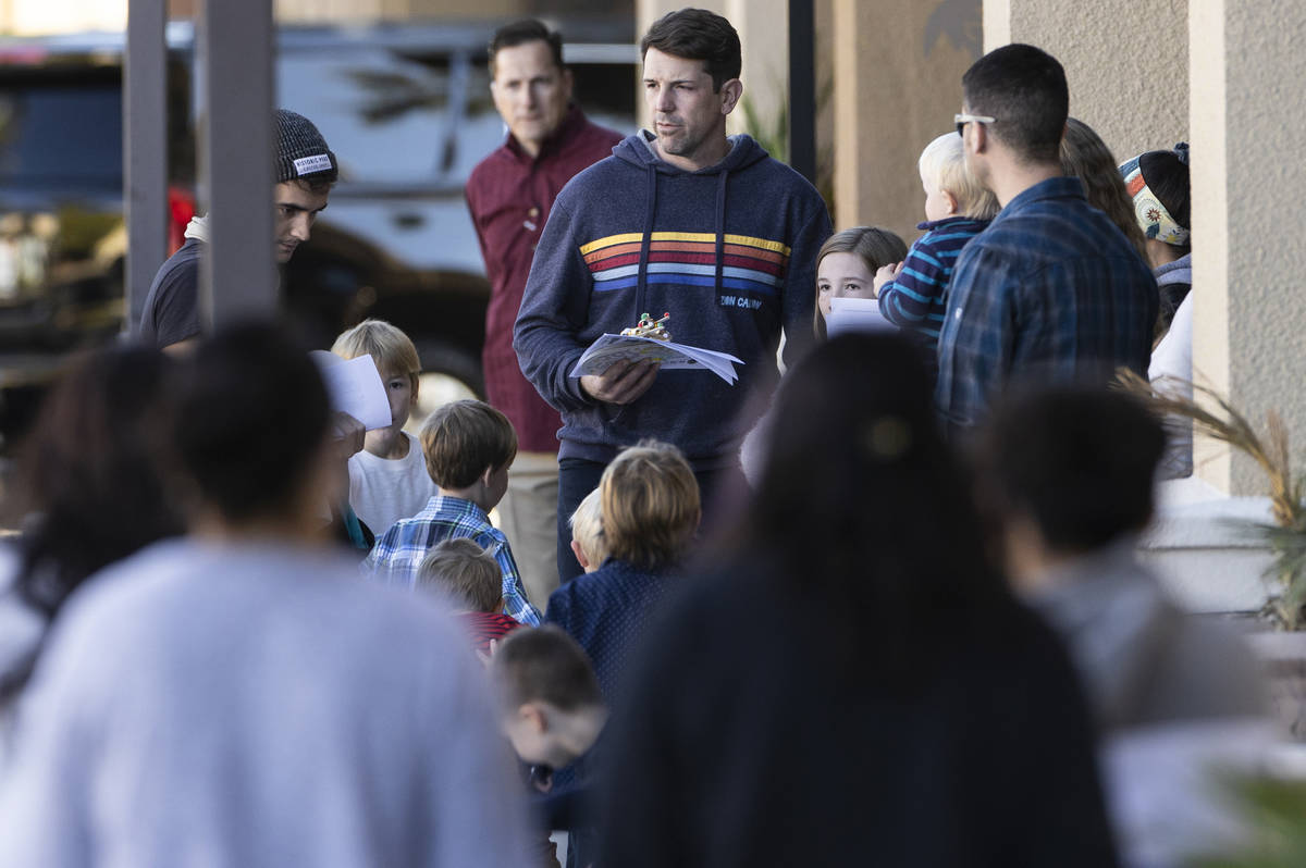 Church members congregate outside Calvary Chapel Lone Mountain before the 11 a.m. service on Su ...