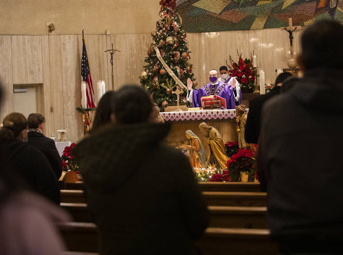 Father Miguel Corral addresses the congregation during Mass at St. Anne's Catholic Church in La ...