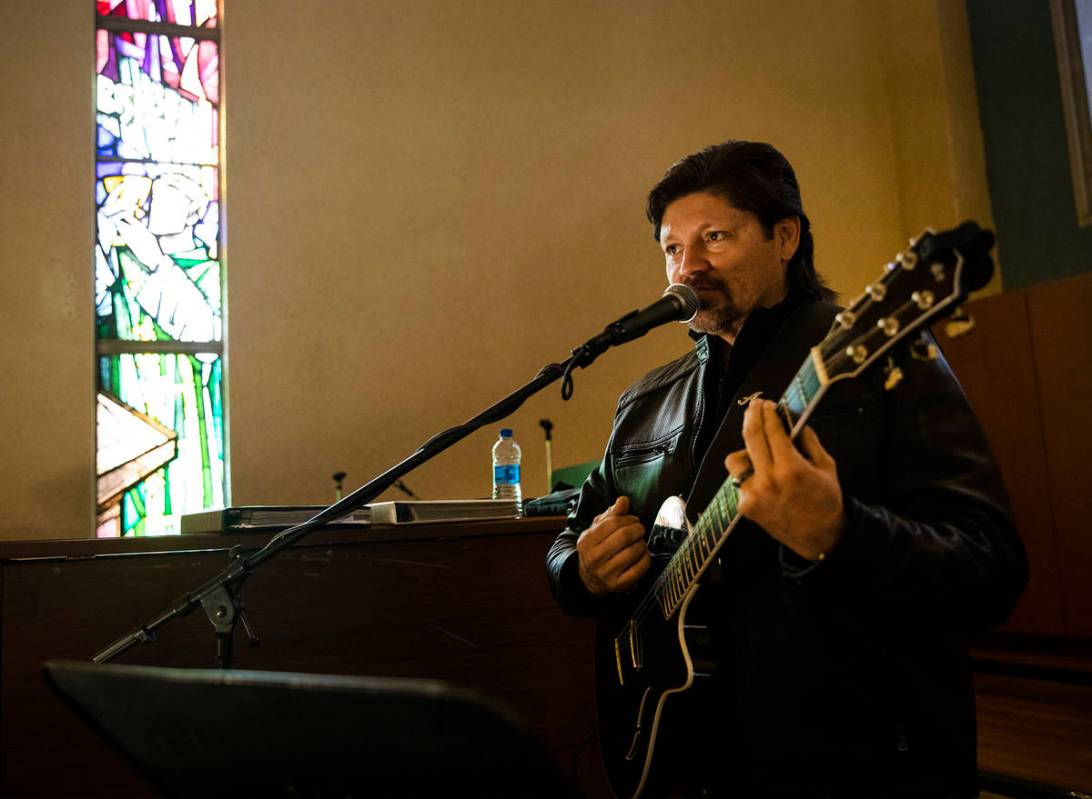 Guitarist Angel Murguia plays during Mass at St. Anne's Catholic Church in Las Vegas, Sunday, D ...