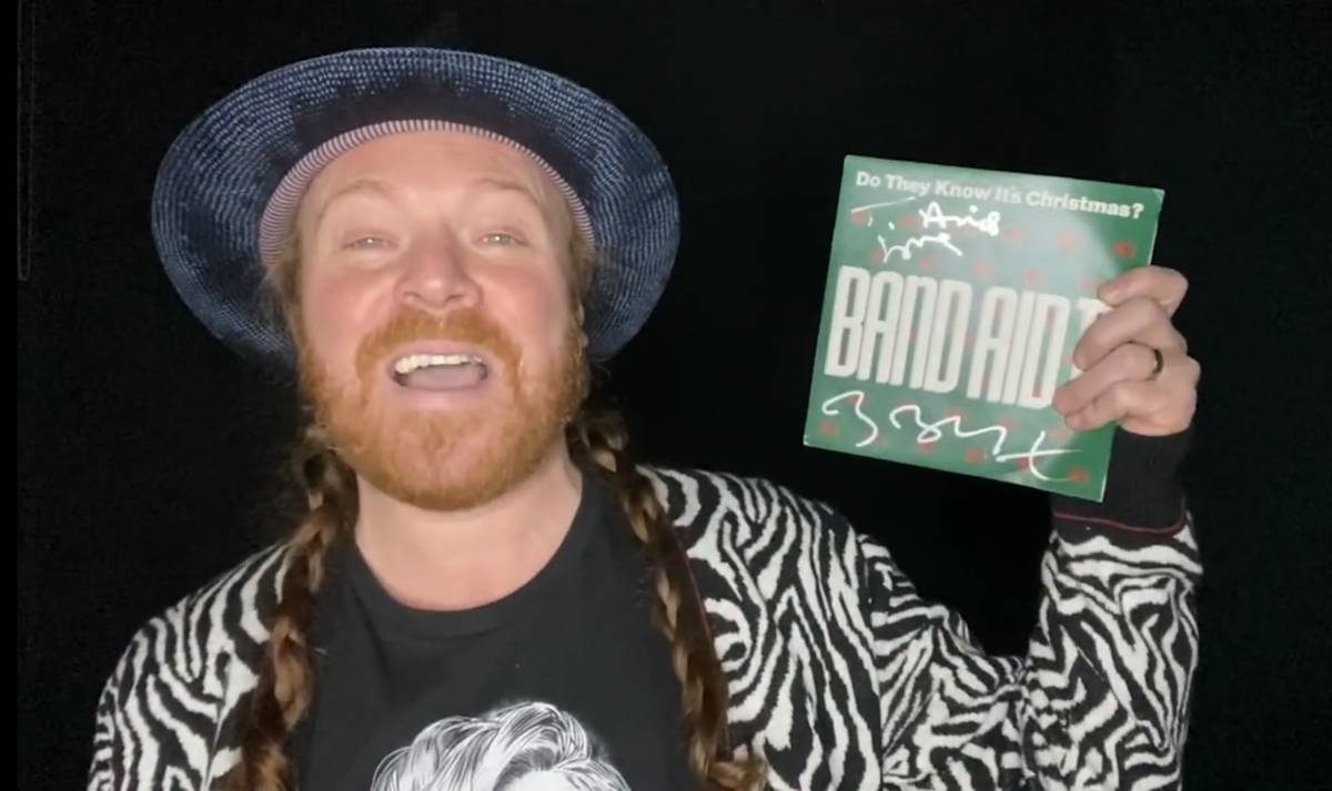 A screen grab of Keith Lemon, holding up a vinyl version of the original Band Aid version of "D ...