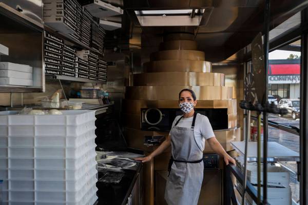 Chef Floriana Pastore is seen in the Signora Pizza Truck parked in the the Pinball Hall parking ...