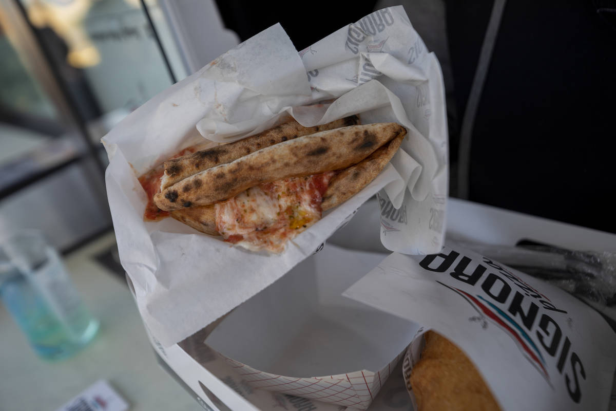 Signora Pizza Truck's Wallet Pizza is seen during the Pinball Hall of Fame launch of a weekly f ...