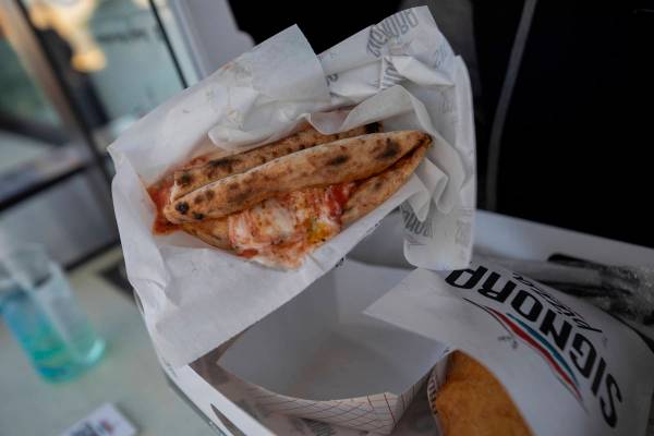 Signora Pizza Truck's Wallet Pizza is seen during the Pinball Hall of Fame launch of a weekly f ...