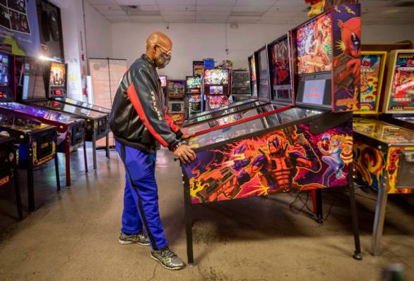 Oliver Blair, 46, of San Antonio, Texas, plays games at the Pinball Hall of Fame, during the la ...