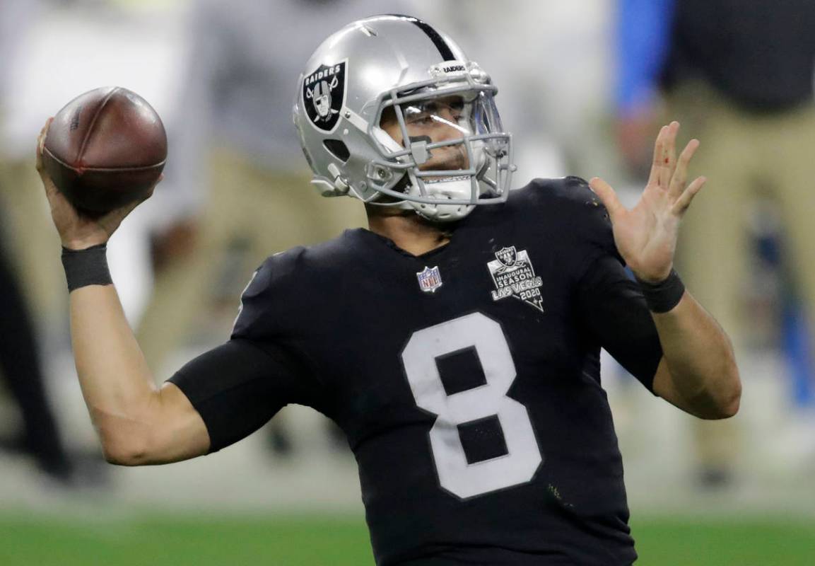 Las Vegas Raiders quarterback Marcus Mariota (8) looks to pass against the Los Angeles Chargers ...