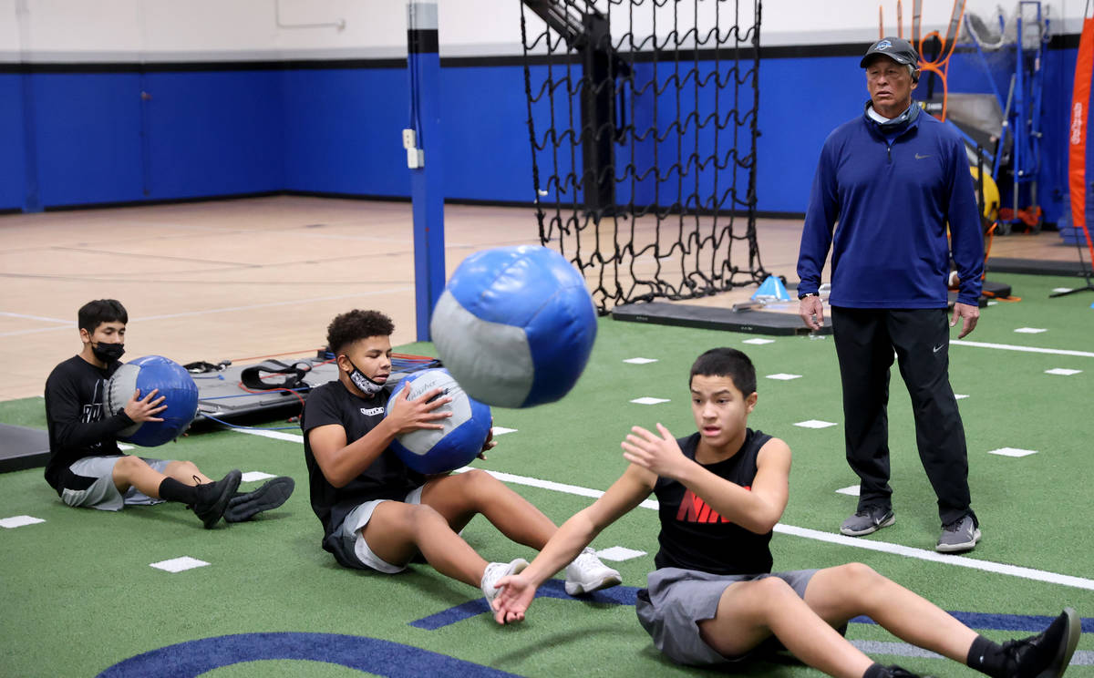 Vinny Passas works with, from left, Jesse Torres, 14, Tyrese Smith, 15, and Furian Inferrera, 1 ...