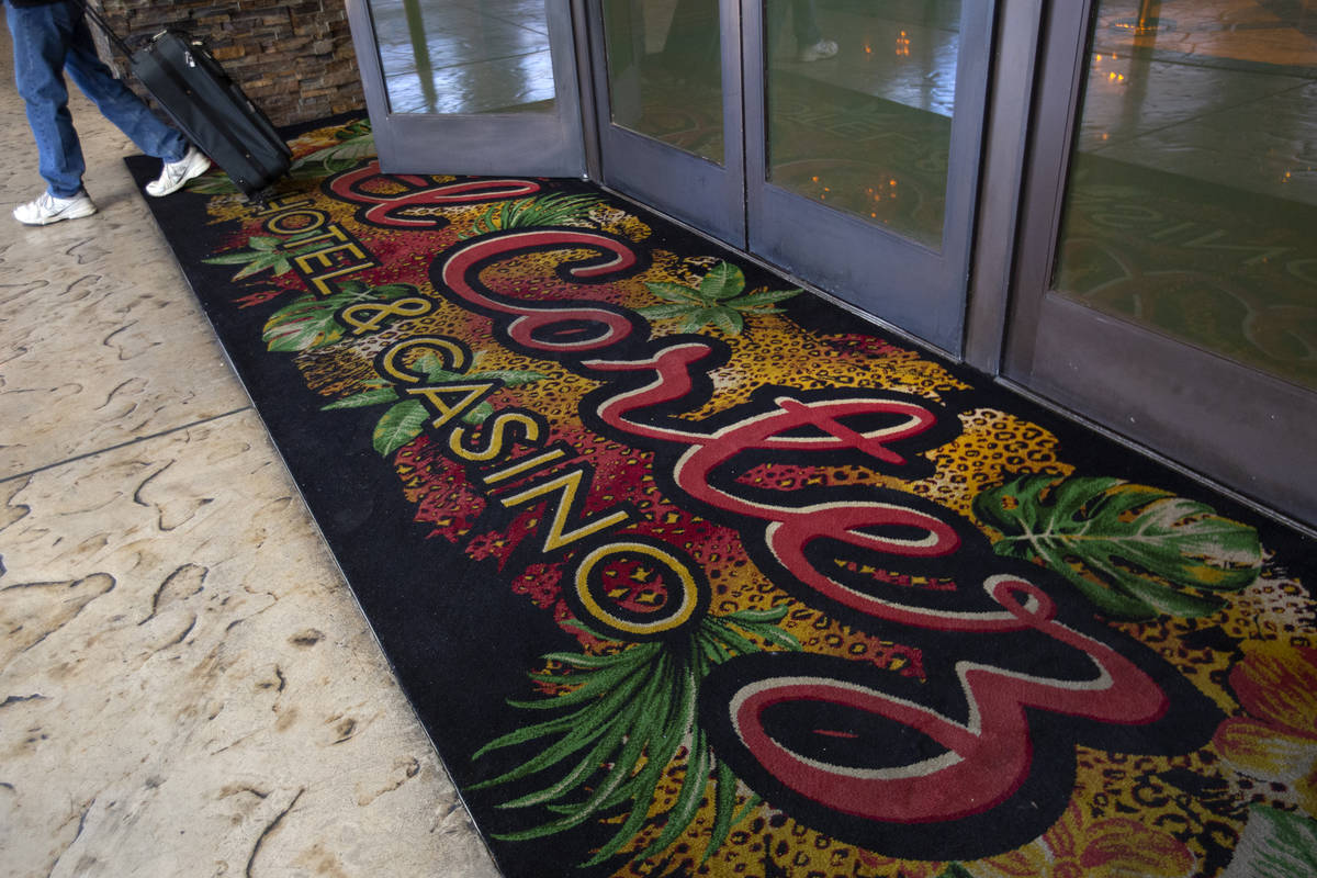 A guest exits the El Cortez, which recently replaced its iconic carpet with this new one in Sep ...