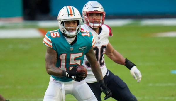 Miami Dolphins running back Lynn Bowden (15) runs after a catch against the New England Patriot ...