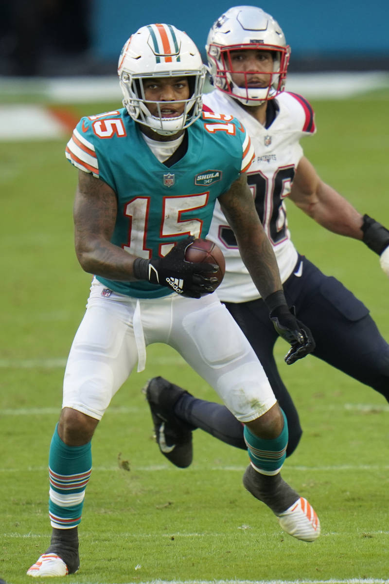 Miami Dolphins running back Lynn Bowden (15) runs during the second half of an NFL football gam ...