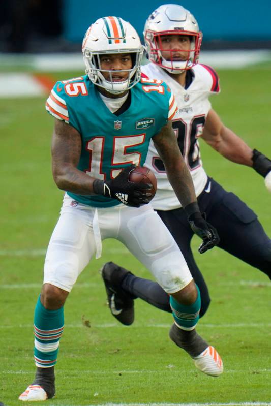 Miami Dolphins running back Lynn Bowden (15) runs during the second half of an NFL football gam ...