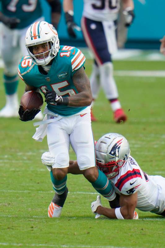New England Patriots cornerback Myles Bryant (41) tackles Miami Dolphins running back Lynn Bowd ...