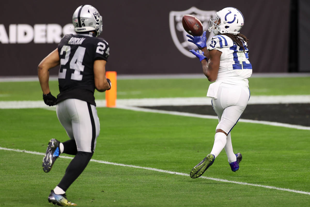 Indianapolis Colts wide receiver T.Y. Hilton (13) makes a touchdown catch under pressure from R ...