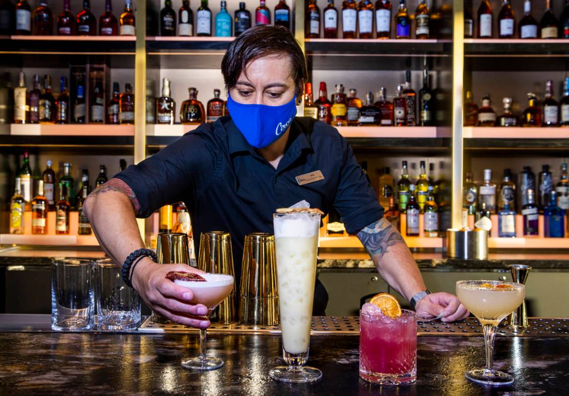 Bartender Mike Guzman mixes drinks at the bar within the Legacy Club at Circa on Tuesday, Dec. ...