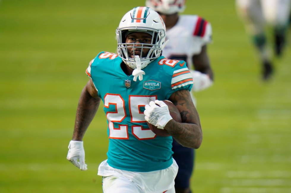 Miami Dolphins cornerback Xavien Howard (25) runs the football during the first half of an NFL ...