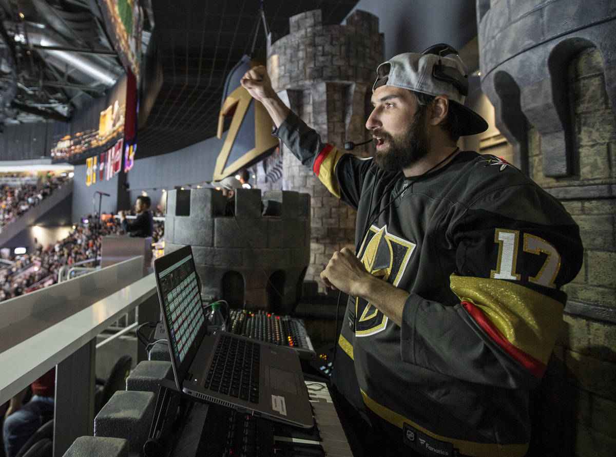 Golden Knights music director Jake Wagner celebrates after Vegas scored a first period goal aga ...