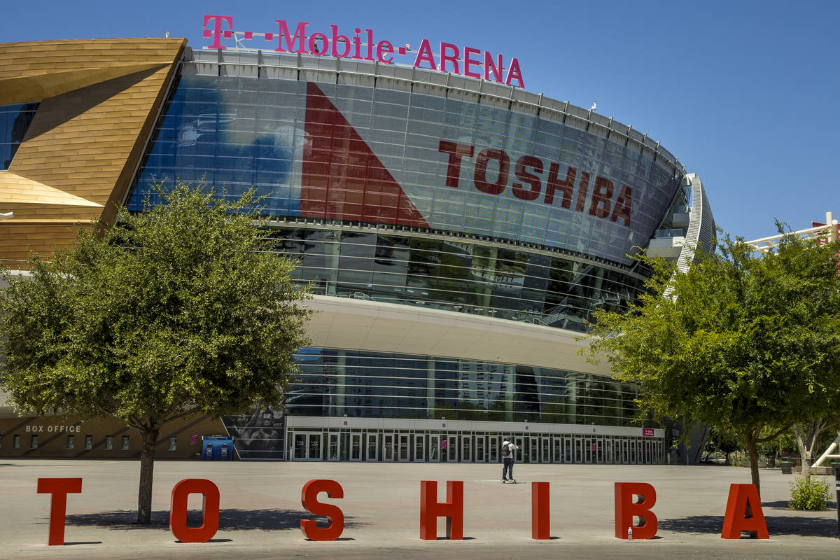 A pedestrian walks in front of the T-Mobile Arena a block off the Las Vegas Strip on Friday, Ma ...