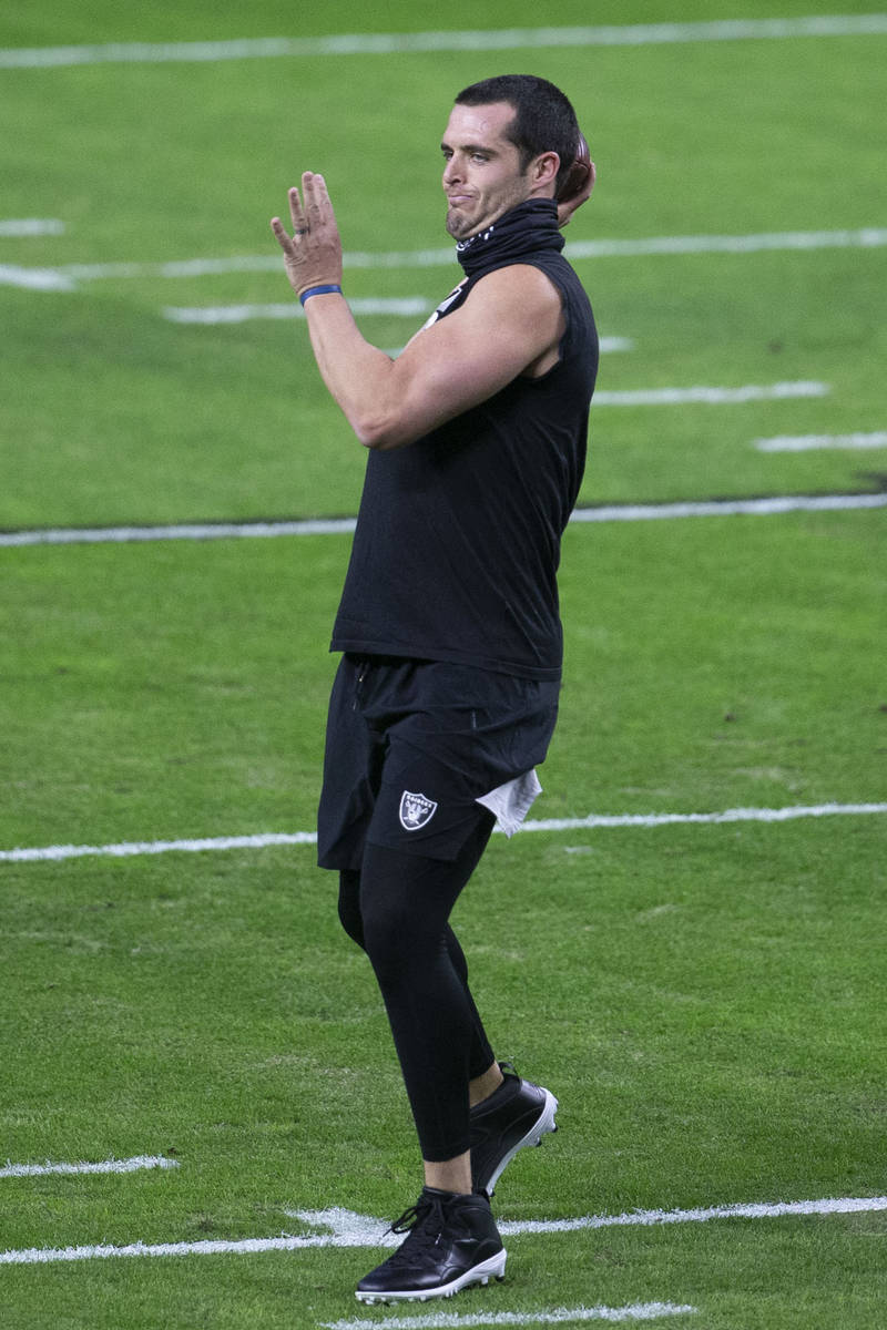 Raiders quarterback Derek Carr (4) warms up before an NFL football game on Saturday, Dec. 26, 2 ...