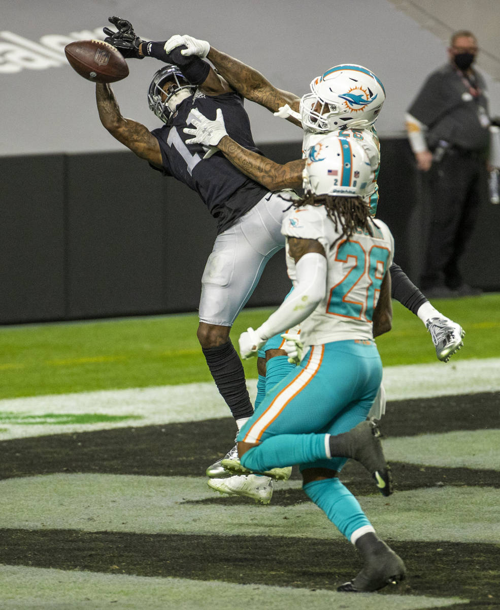 Raiders wide receiver Henry Ruggs III (11) has a touchdown pass get through his hands with Miam ...