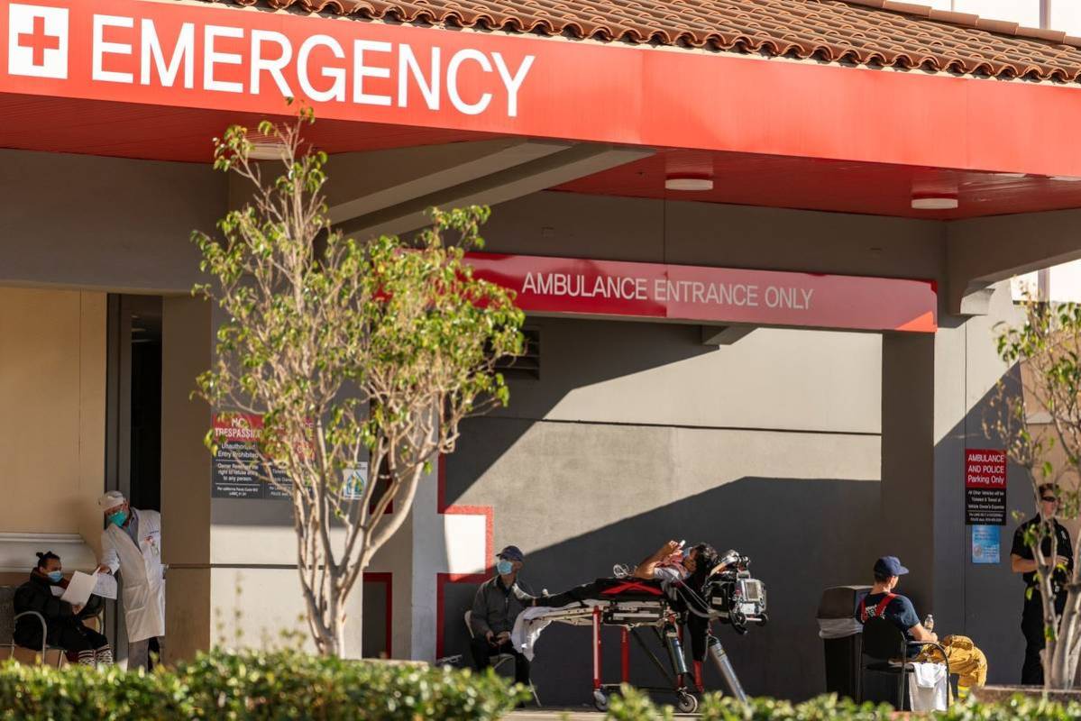 An unidentified patient receives oxygen on a stretcher, while Los Angeles Fire Department Param ...