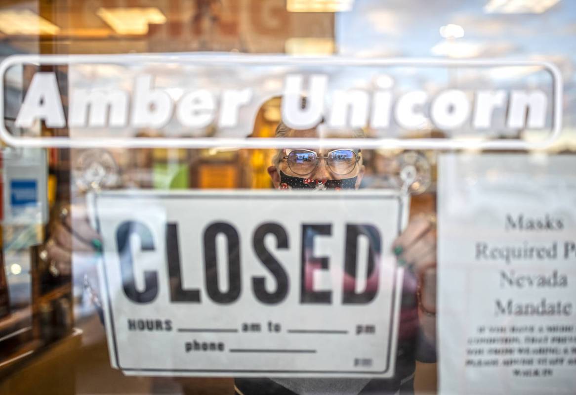 Myrna Donato, owner of Amber Unicorn Books, closes shop on the last business day at the Vegas l ...