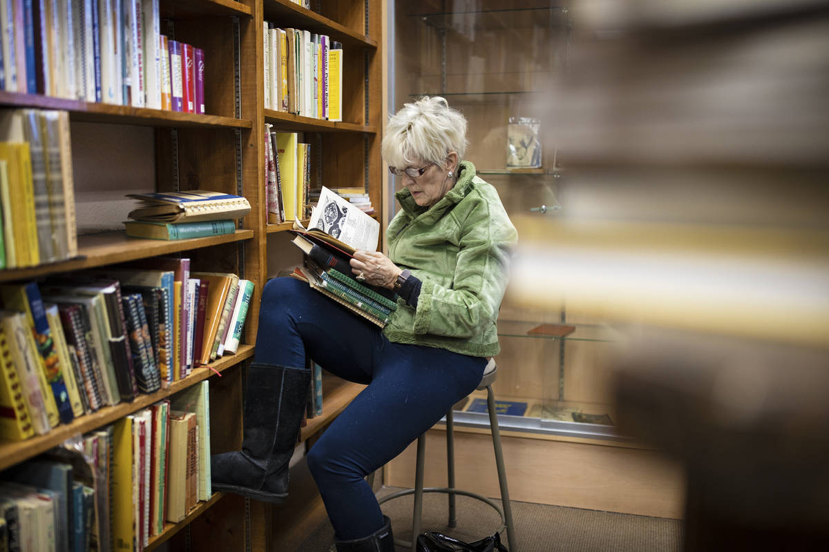 Mary Martinez shops at Amber Unicorn Books on the last business day at the Vegas landmark on Su ...