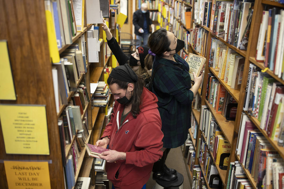 Nicholas Bar, bottom/left, and Jacqueline Lee shop at Amber Unicorn Books on the last business ...
