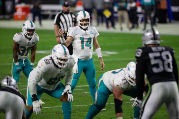 Miami Dolphins quarterback Ryan Fitzpatrick (14) calls a play at the line of scrimmage during t ...