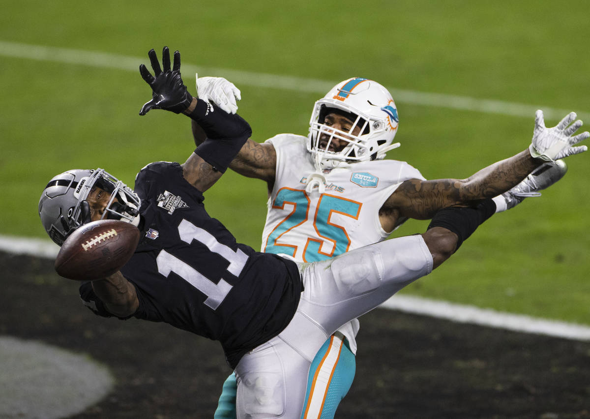 Raiders wide receiver Henry Ruggs III (11) is unable to catch the ball as Miami Dolphins corner ...