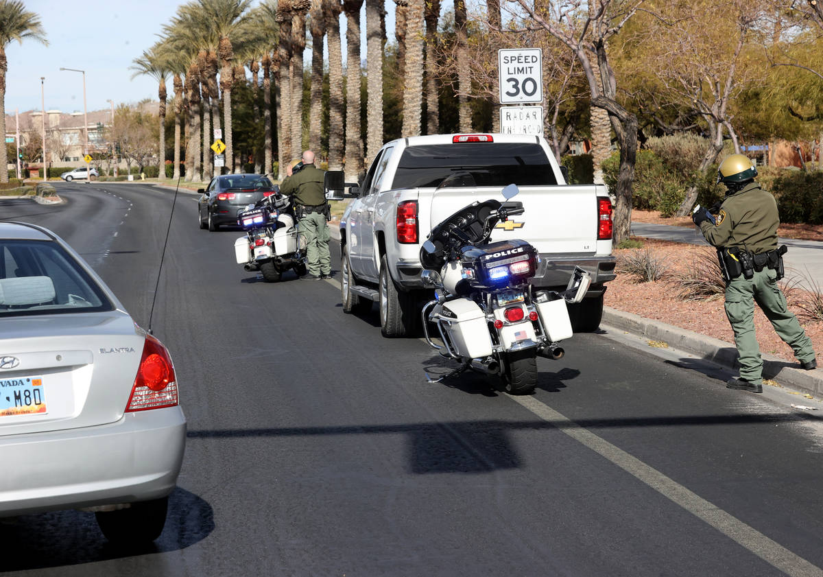 Las Vegas police officers B. Layne, left, and J. Quintana pull over motorists during an enforce ...