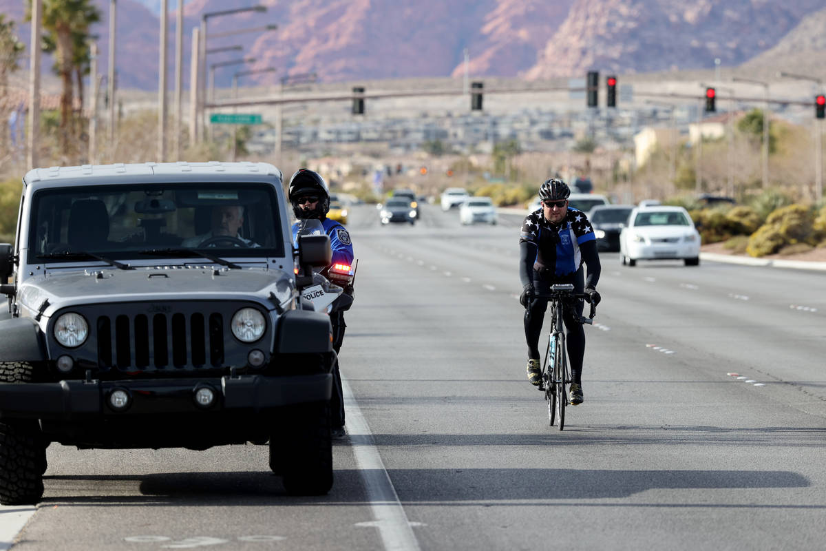 A North Las Vegas Police officer pulls over a motorist as Sgt. Michael Campbell, a traffic serg ...