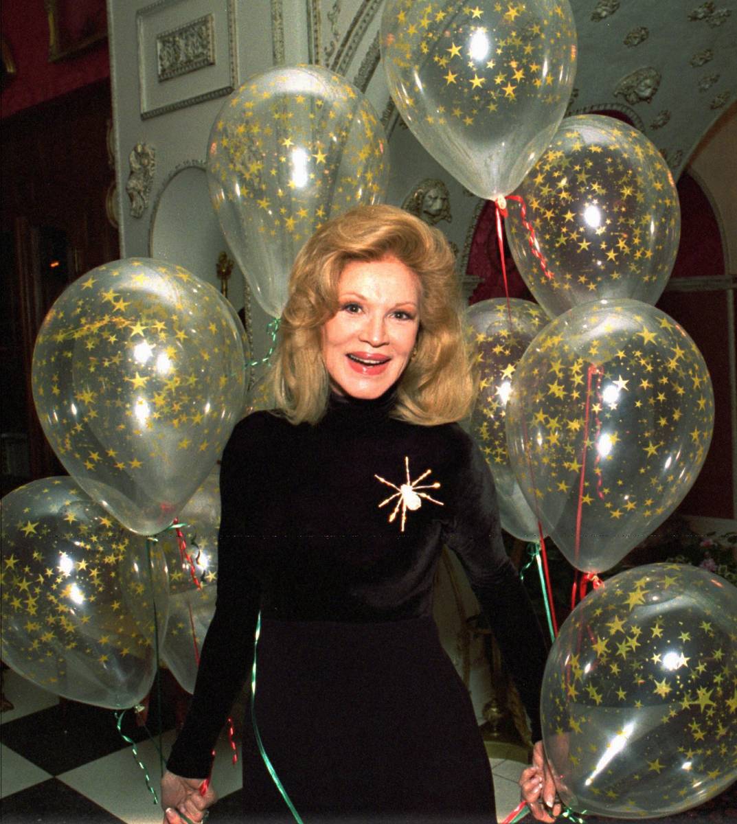 Singer Phyllis McGuire receives a cluster of balloons at her Las Vegas home Dec. 12, 1995. (The ...