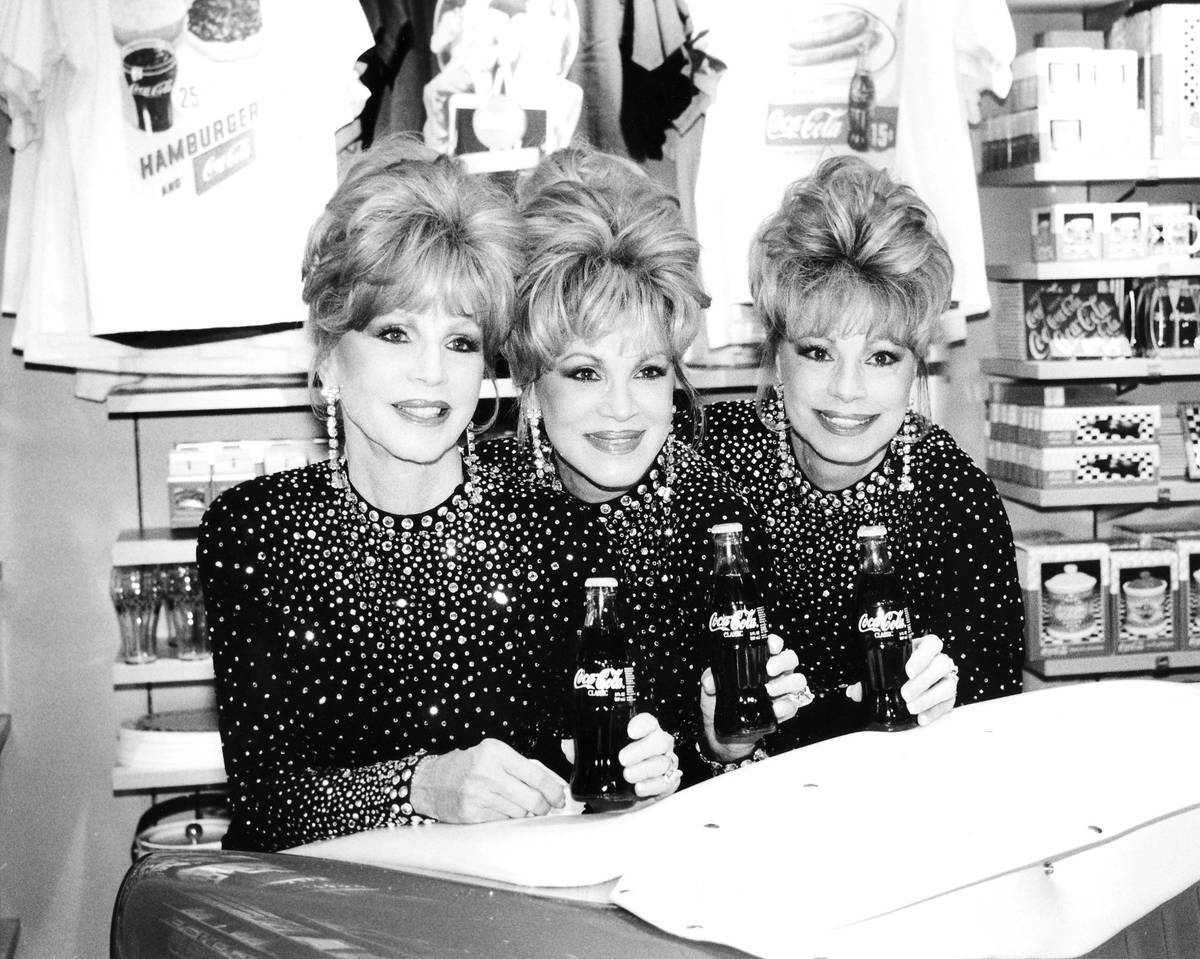 The McGuire Sisters, Christine, Phyllis and Dorothy, at the opening of the World of Coca Cola o ...