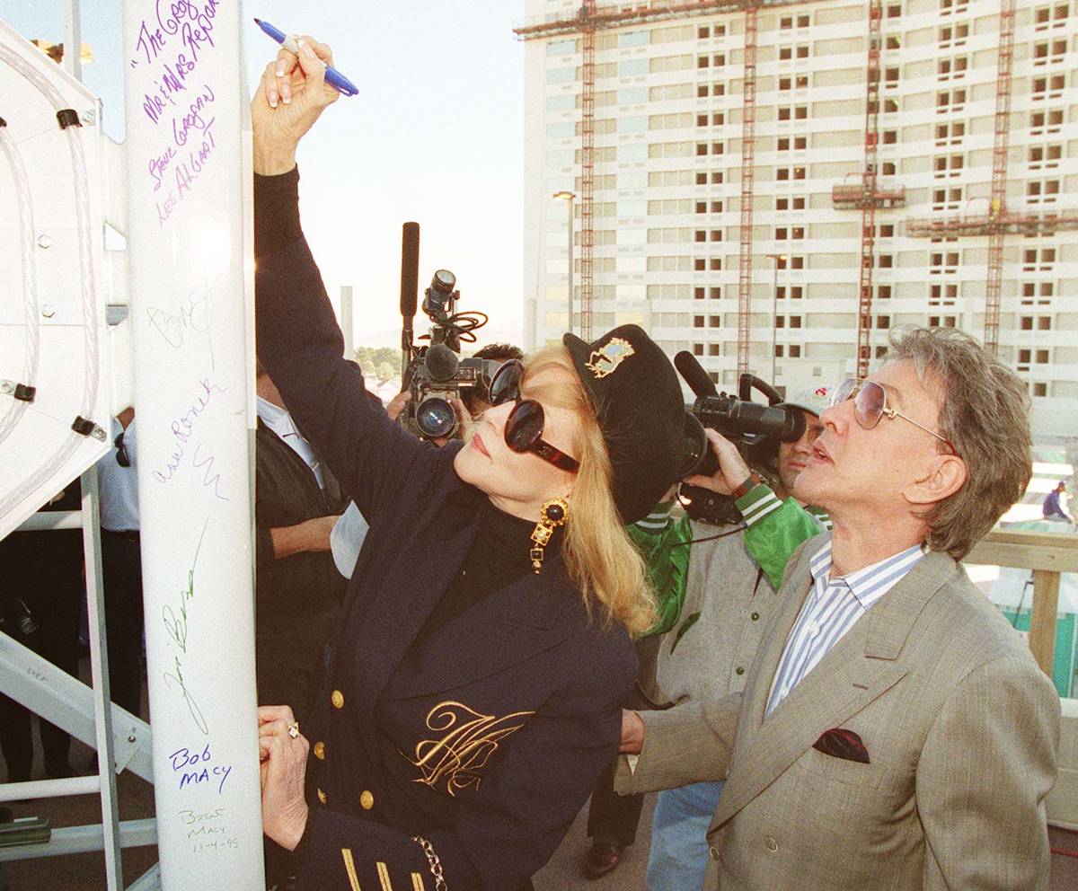 Phyllis McGuire signs the top spire of the Stratosphere Tower before it was placed on Nov 4, 19 ...