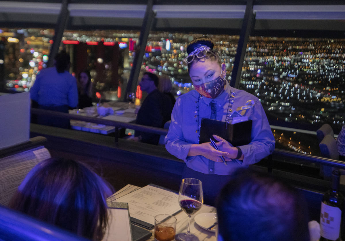 Server Armida Gonzalez takes guests orders at the Top of the World at the Strat onThursday, Dec ...