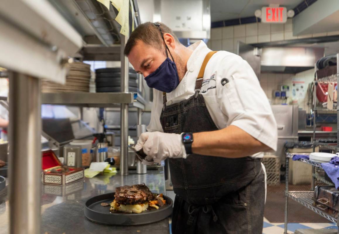 Chef Stephen Blandino finishes a course at Americana on Thursday, Dec. 31, 2020, in Las Vegas. ...