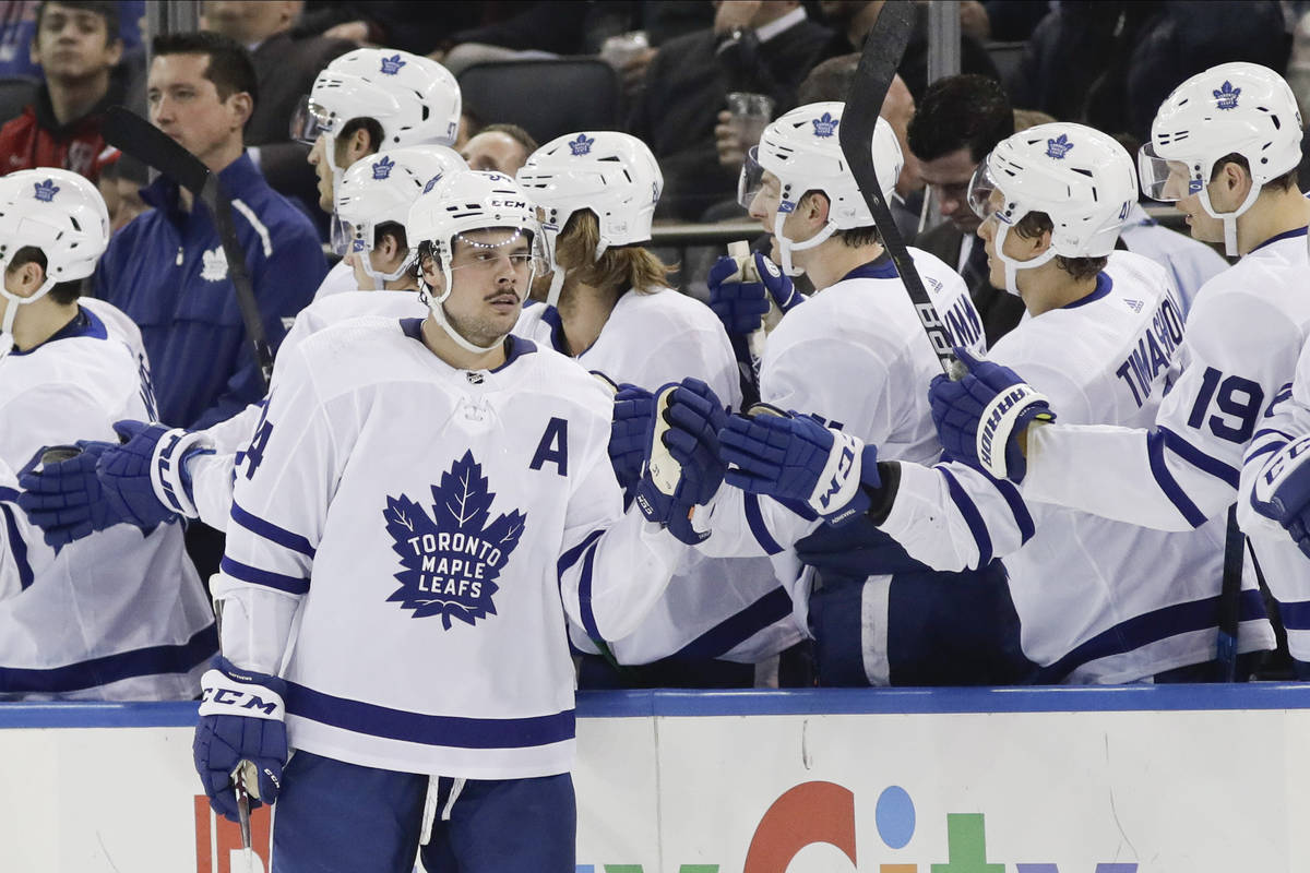 Toronto Maple Leafs' Auston Matthews (34) celebrates with teammates after scoring a goal during ...