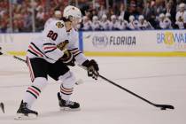 Chicago Blackhawks left wing Brandon Saad (20) skates with the puck during the first period of ...